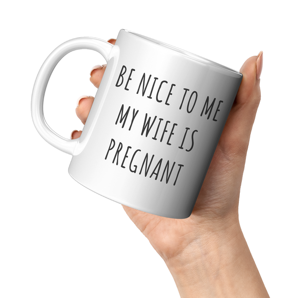 Be_Nice_to_Me_My_Wife_is_Pregnant_Mug_Ex_11oz_White_LH_Model_Mockup.png