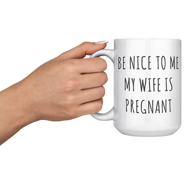 Be_Nice_to_Me_My_Wife_is_Pregnant_Mug_Ex_15oz_White_LH_Model_Mockup.png
