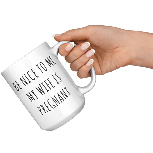 Be_Nice_to_Me_My_Wife_is_Pregnant_Mug_Ex_15oz_White_RH_Model_Mockup.png